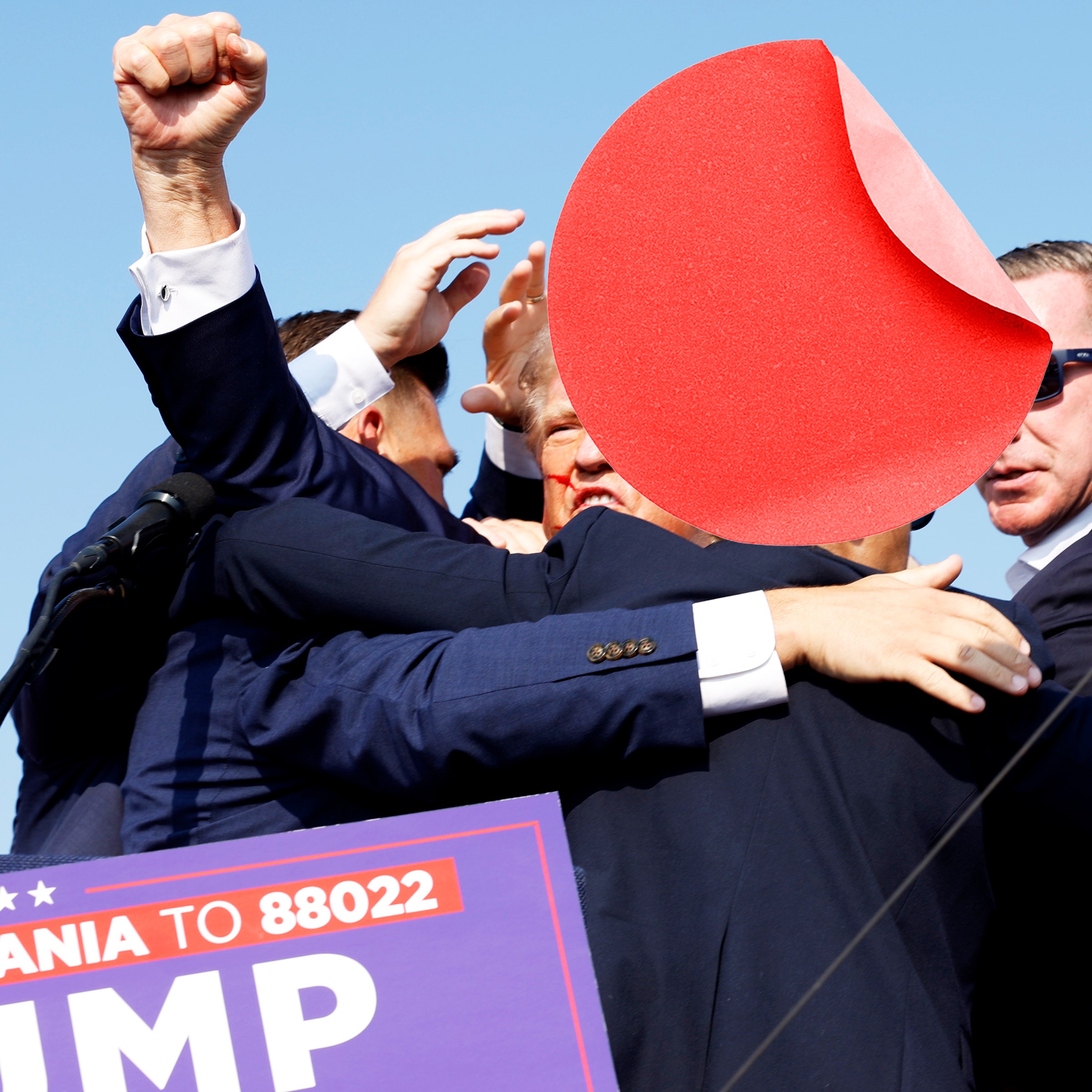 A photo of a red sticker placed on top of an image of Republican presidential candidate former President Donald Trump...