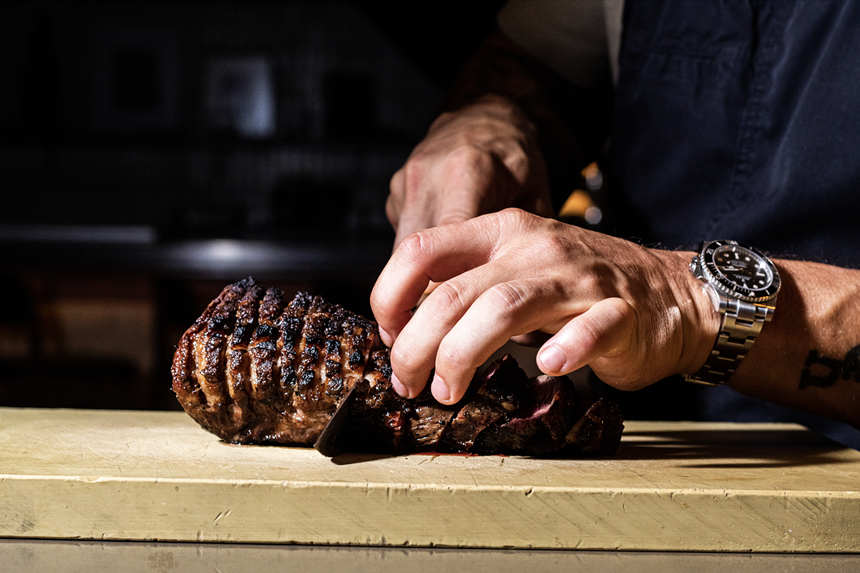 a piece of steak being sliced