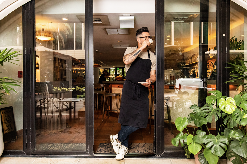 a man posing with coffee