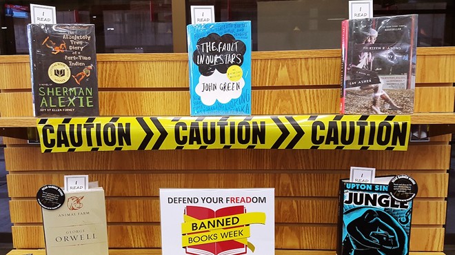 a bookstore display commemorating Banned Books week, featuring titles by Sherman Alexie, Jay Asher, John Greene, George Orwell, and Upton Sinclair