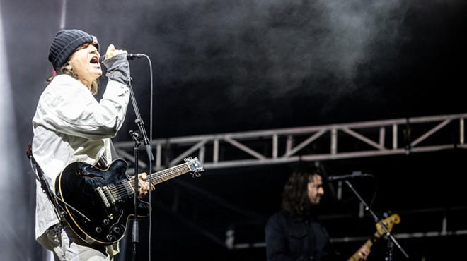 A man performs onstage.