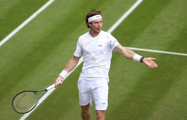 Andrey Rublev reacts as he plays against Francisco Comesana of Argentina at Wimbledon 2024