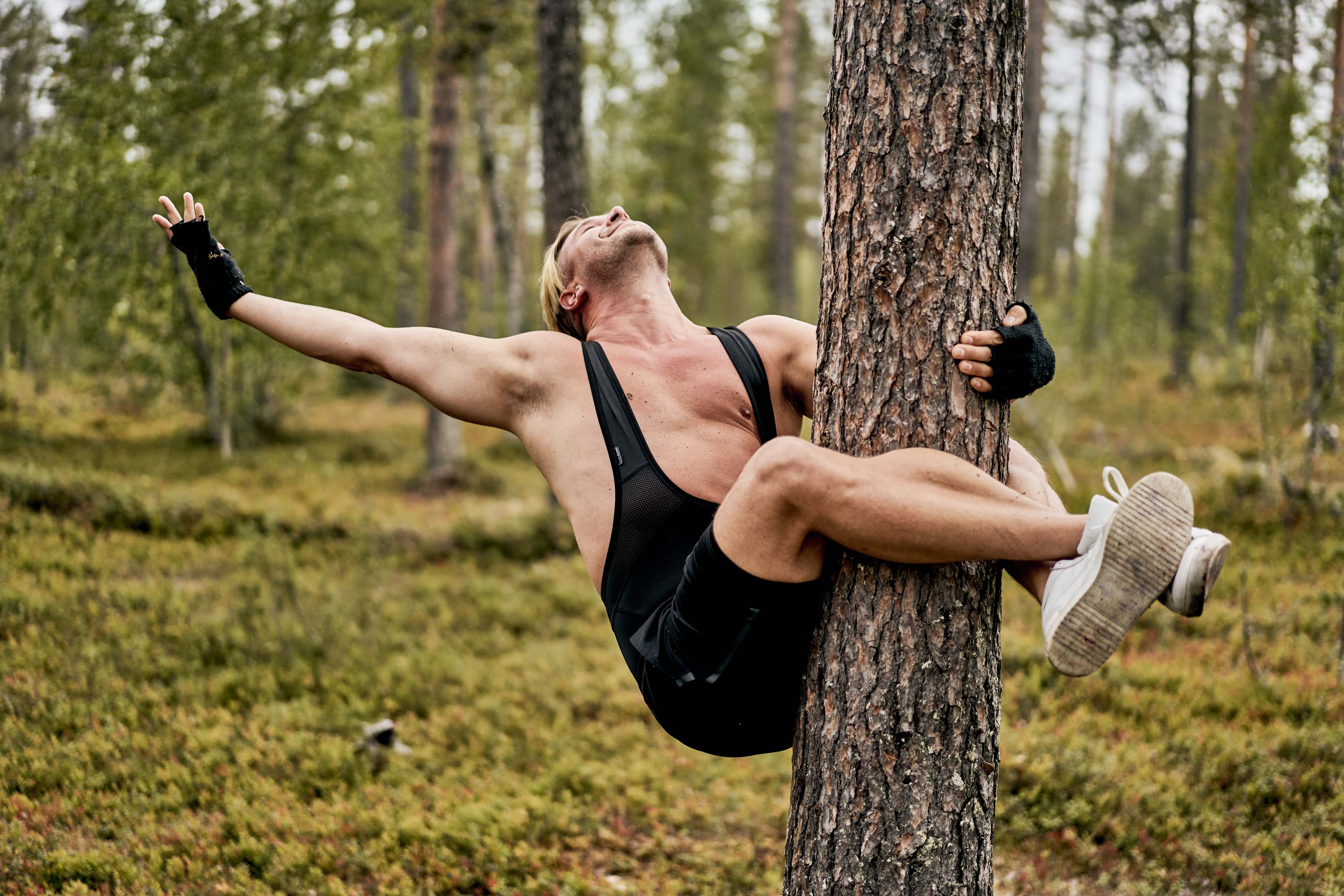 Person hugging a tree in Finland.