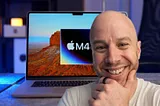 Mark Ellis smiling with hand to chin in front of an Apple MacBook with the Apple M4 chip logo on the screen.