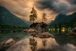 island in lake with lightening