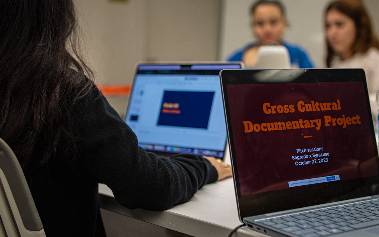 A computer screen reads "Cross Cultural Documentary Project"