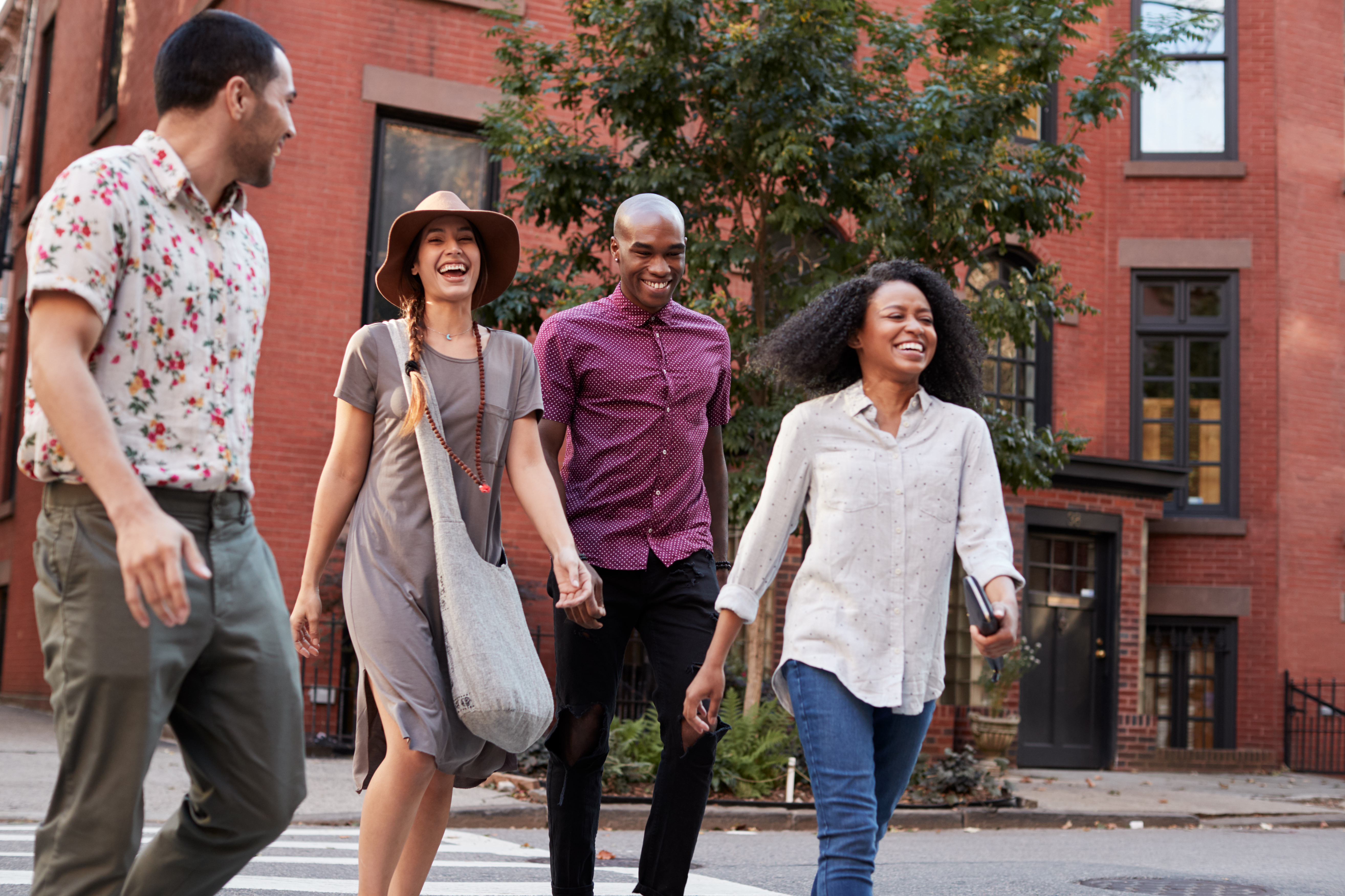 Group of people smiling and walking