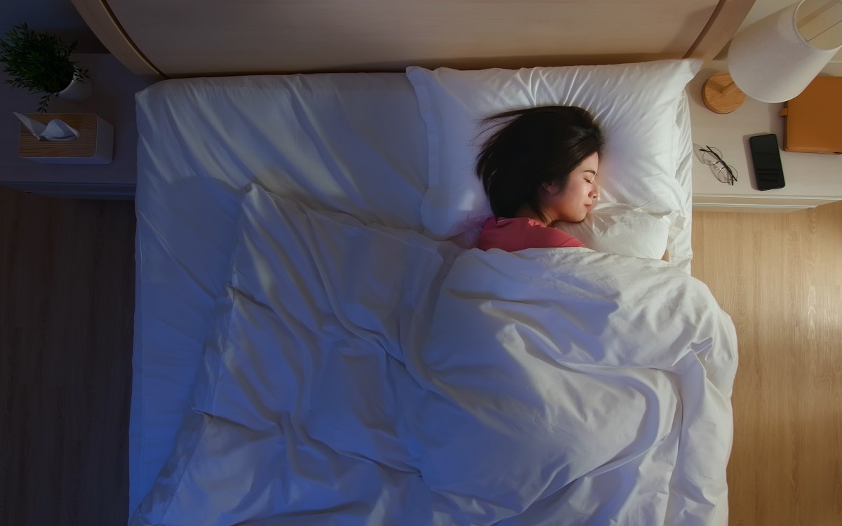 Woman sleeping in bed.