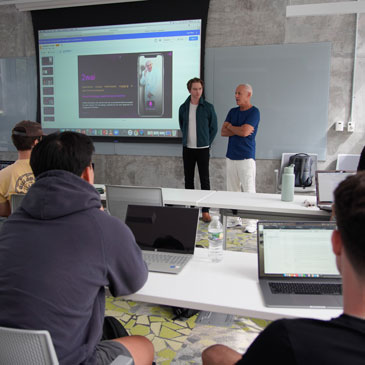 Calum Worthy and Russell Geyser speaking to the design thinking class