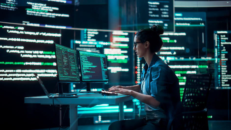 A woman coding on the computer