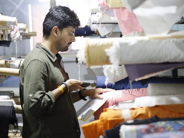 man scanning textiles with device