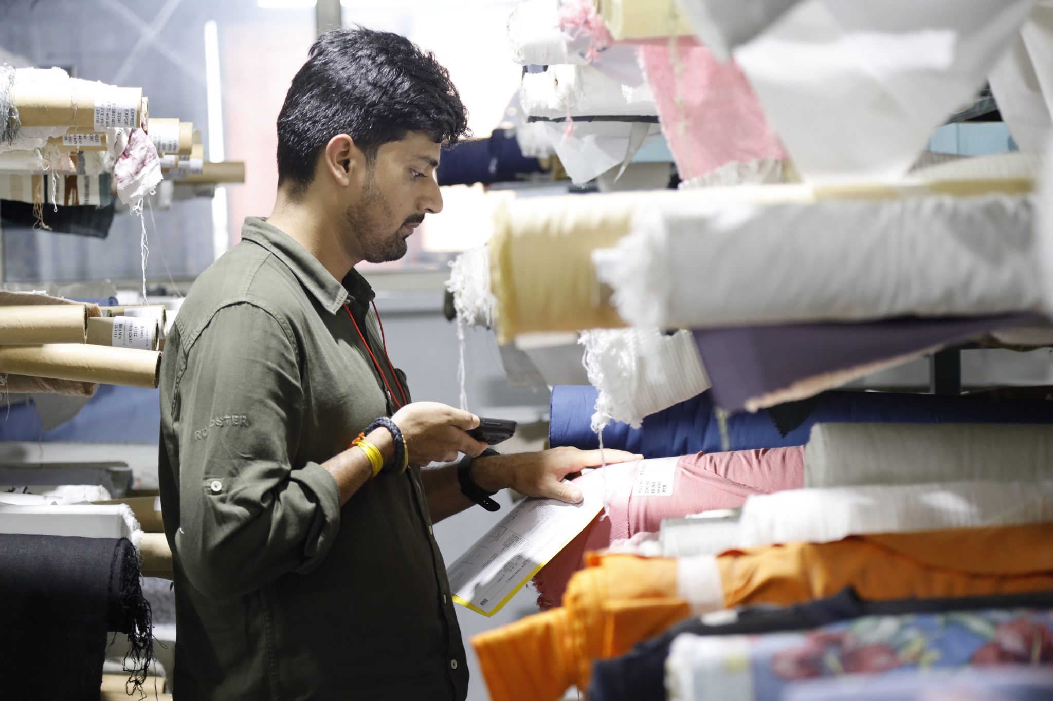 man scanning textiles with device