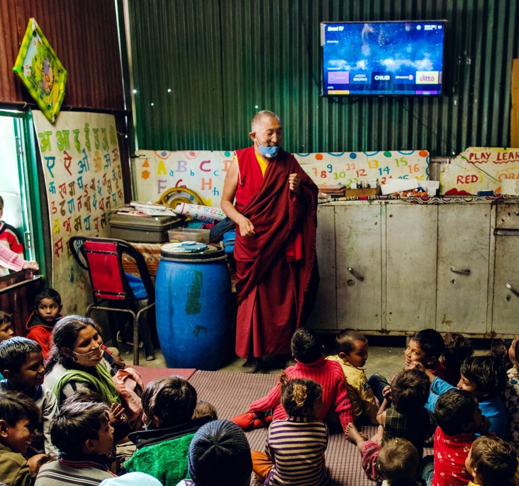 man speaking to children