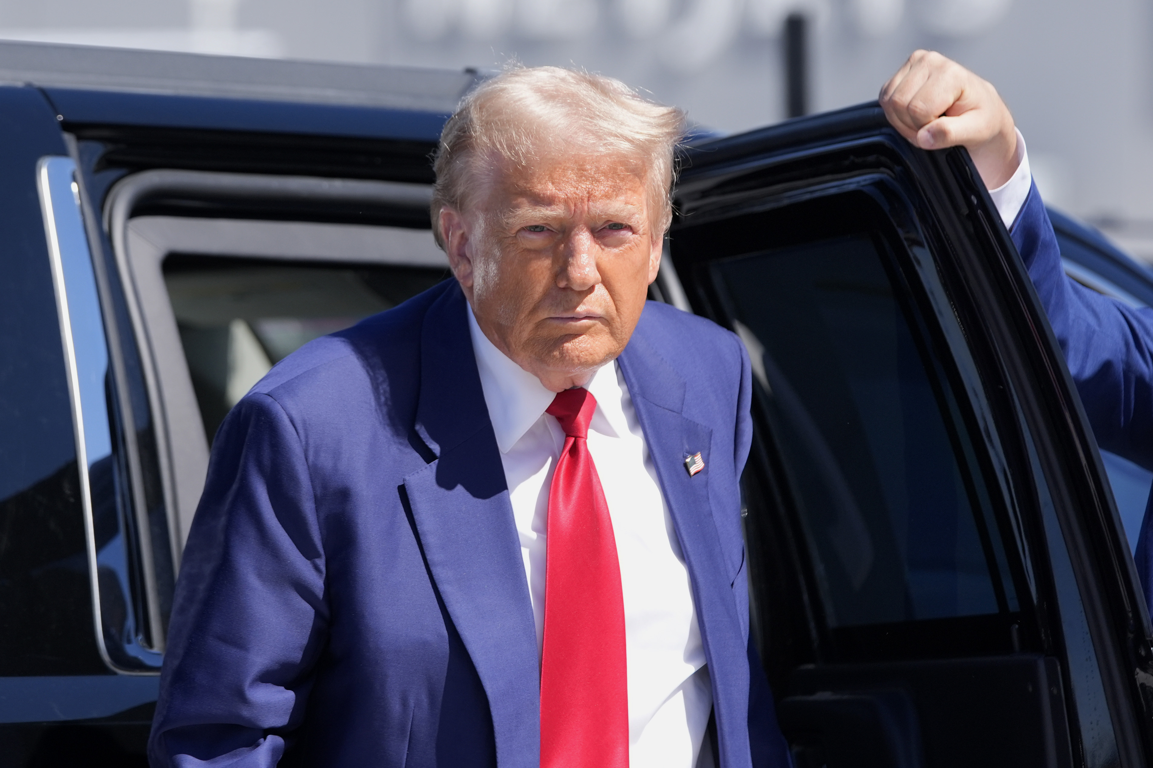 Republican presidential nominee, former President Donald Trump, arrives at Harry Reid International Airport to board a plane after a campaign trip on Saturday in Las Vegas.