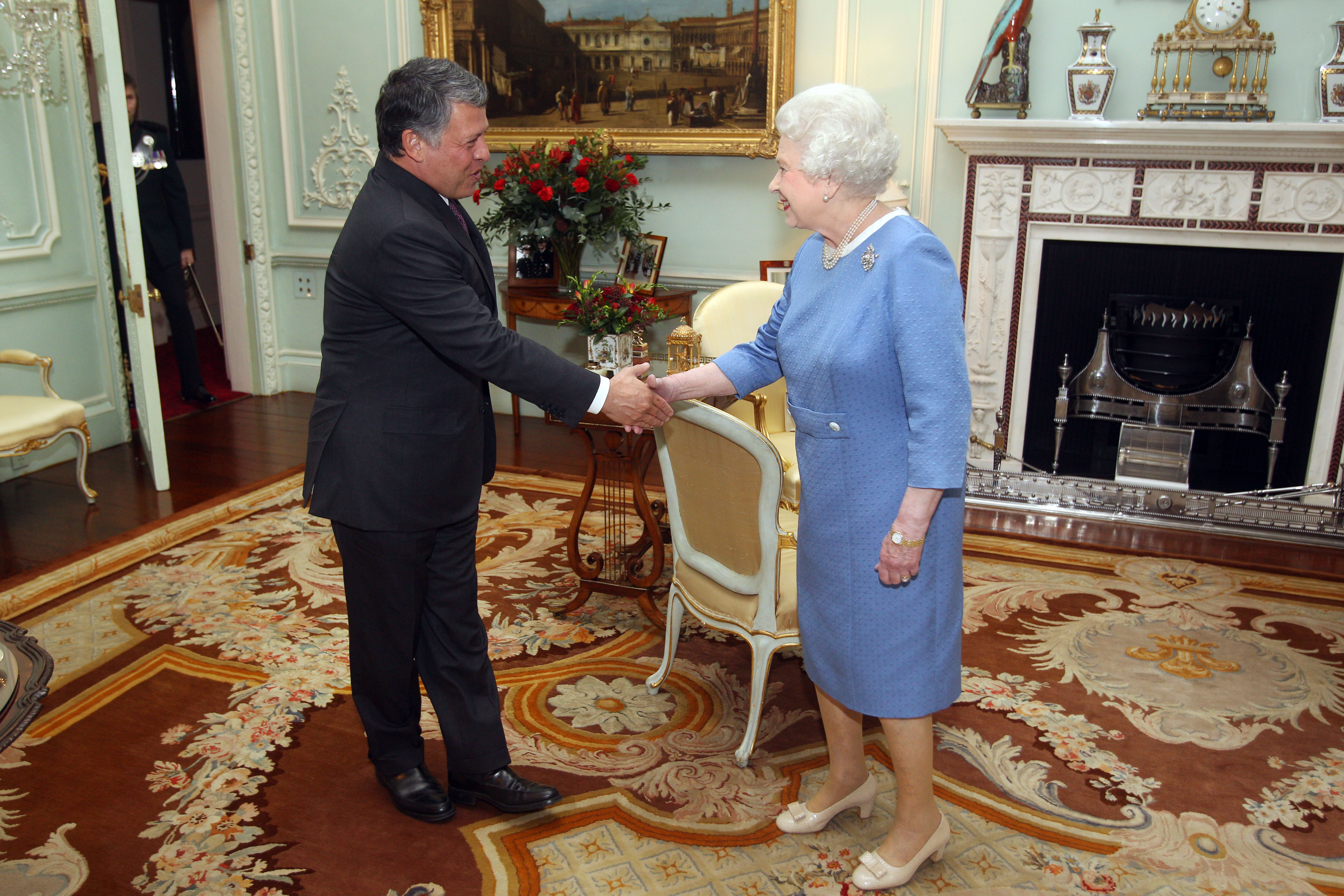 Queen Elizabeth II greets King Abdullah II of Jordan at Buckingham Palace in 2011.