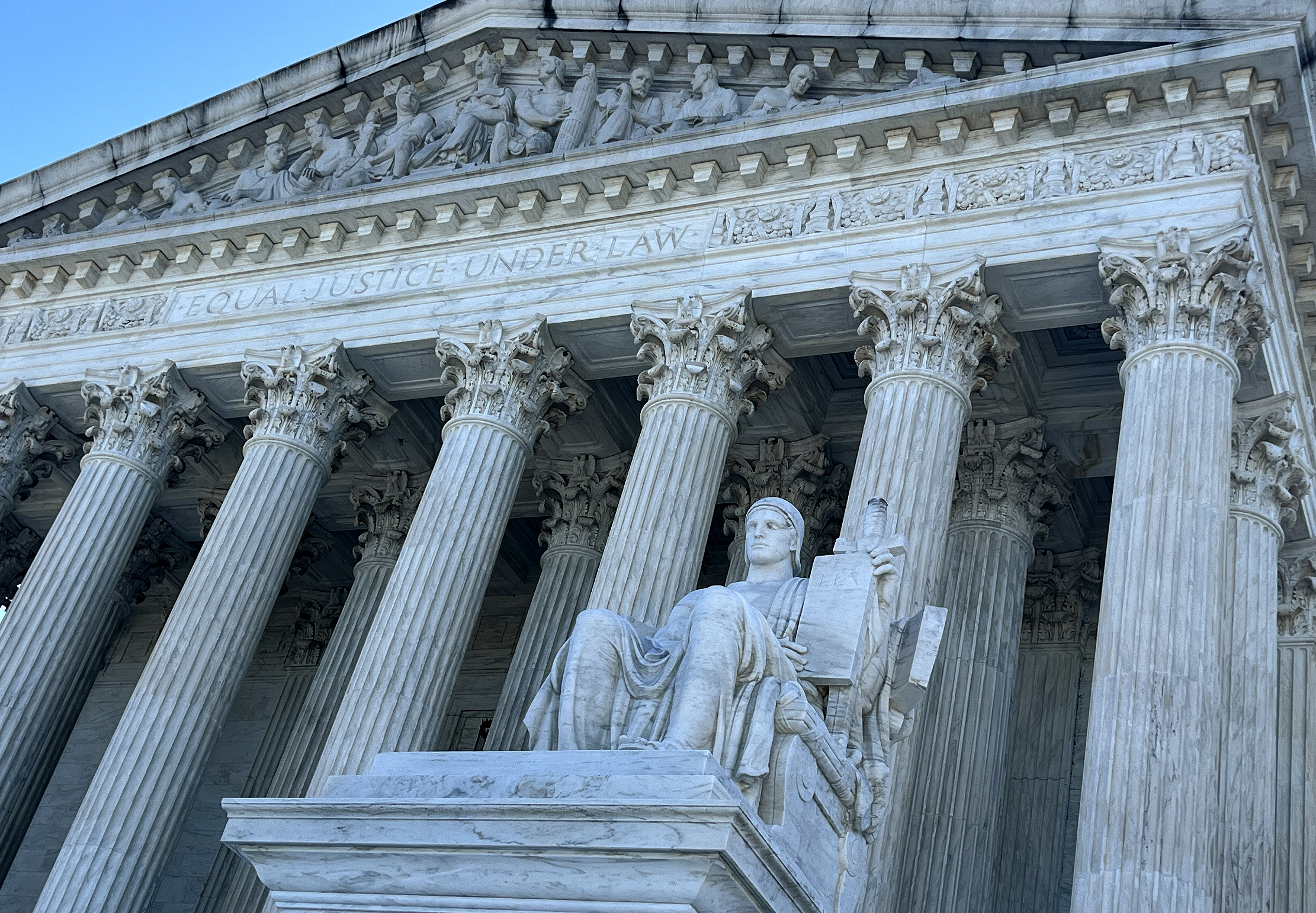 The statue Guardian or Authority of Law sits above the west front plaza of the U.S. Supreme Court on June 7, 2024 in Washington, D.C. Among the rulings the court is expected to issue by the end of June are cases about access to abortion pills dispensed by mail, gun restrictions the power of regulatory agencies and former President Donald Trump’s bid to avoid criminal charges for trying to overturn his 2020 election defeat. 