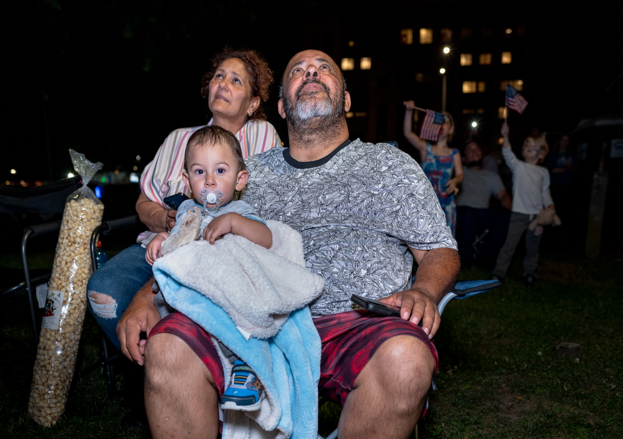 A family watches the fireworks in Middletown, Connecticut.