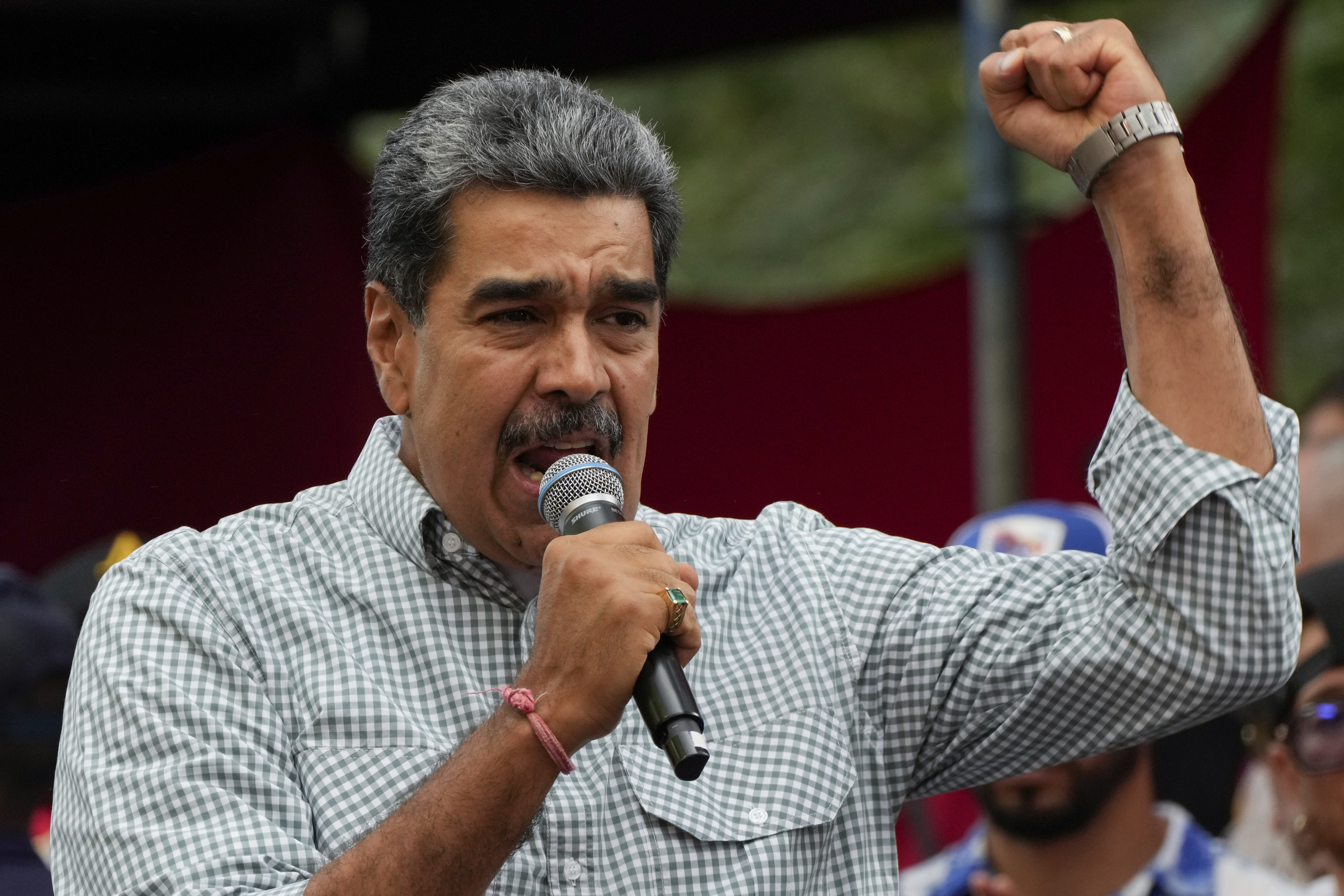 Venezuelan President Nicolas Maduro addresses government loyalists gathered at the presidential palace in support of his reelection one month after the presidential vote, in Caracas, Venezuela on Aug. 28, 2024.