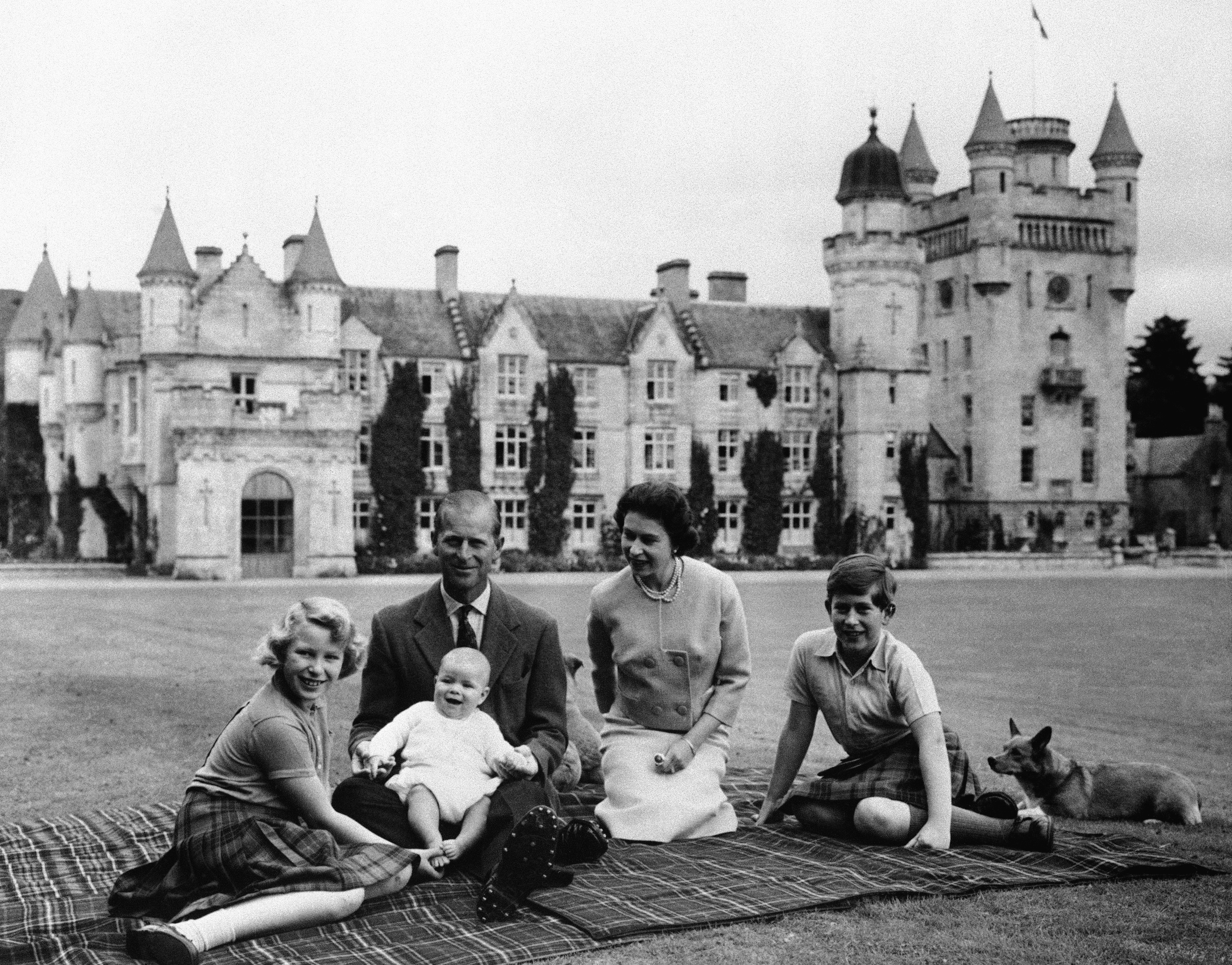 Queen Elizabeth, Prince Philip and their children, Prince Charles (right), Princess Anne and Prince Andrew, pose for a photo on the lawn of Balmoral Castle in Scotland, in 1960.