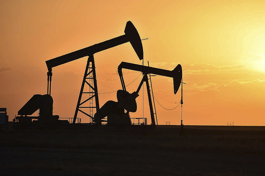 Pump jacks extract oil from beneath the ground in North Dakota on May 19, 2021. The federal government announced a $241.5 million settlement with Marathon Oil on Thursday for alleged air quality violations at the company's oil and gas operations in the Forth Berthold Indian Reservation in North Dakota. 