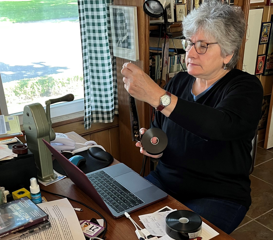  Audrey Kupferberg examines a film roll in her office