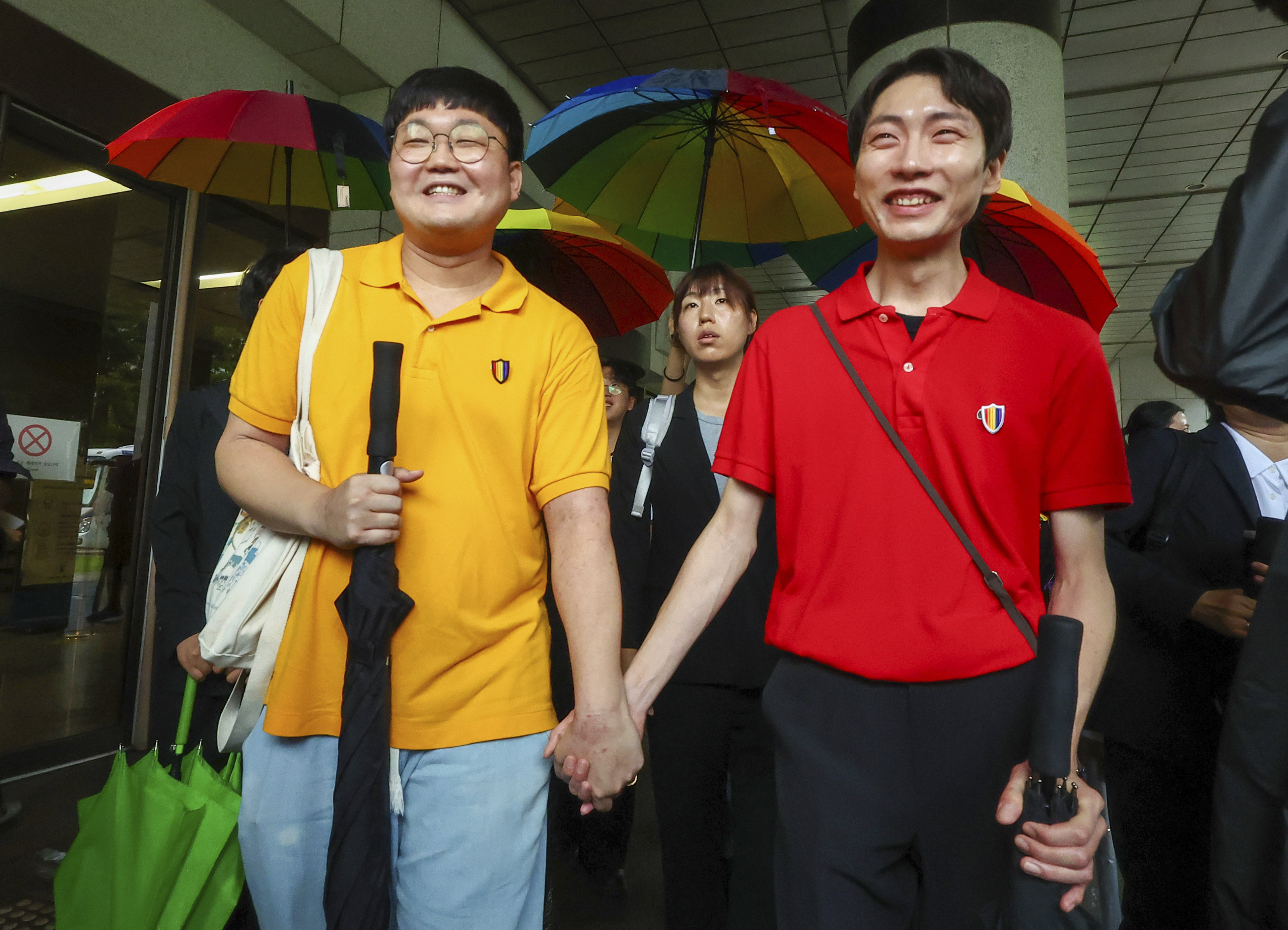 So Seong-wook (left) and Kim Yong Min leave the Supreme Court building in Seoul, South Korea, on Thursday.