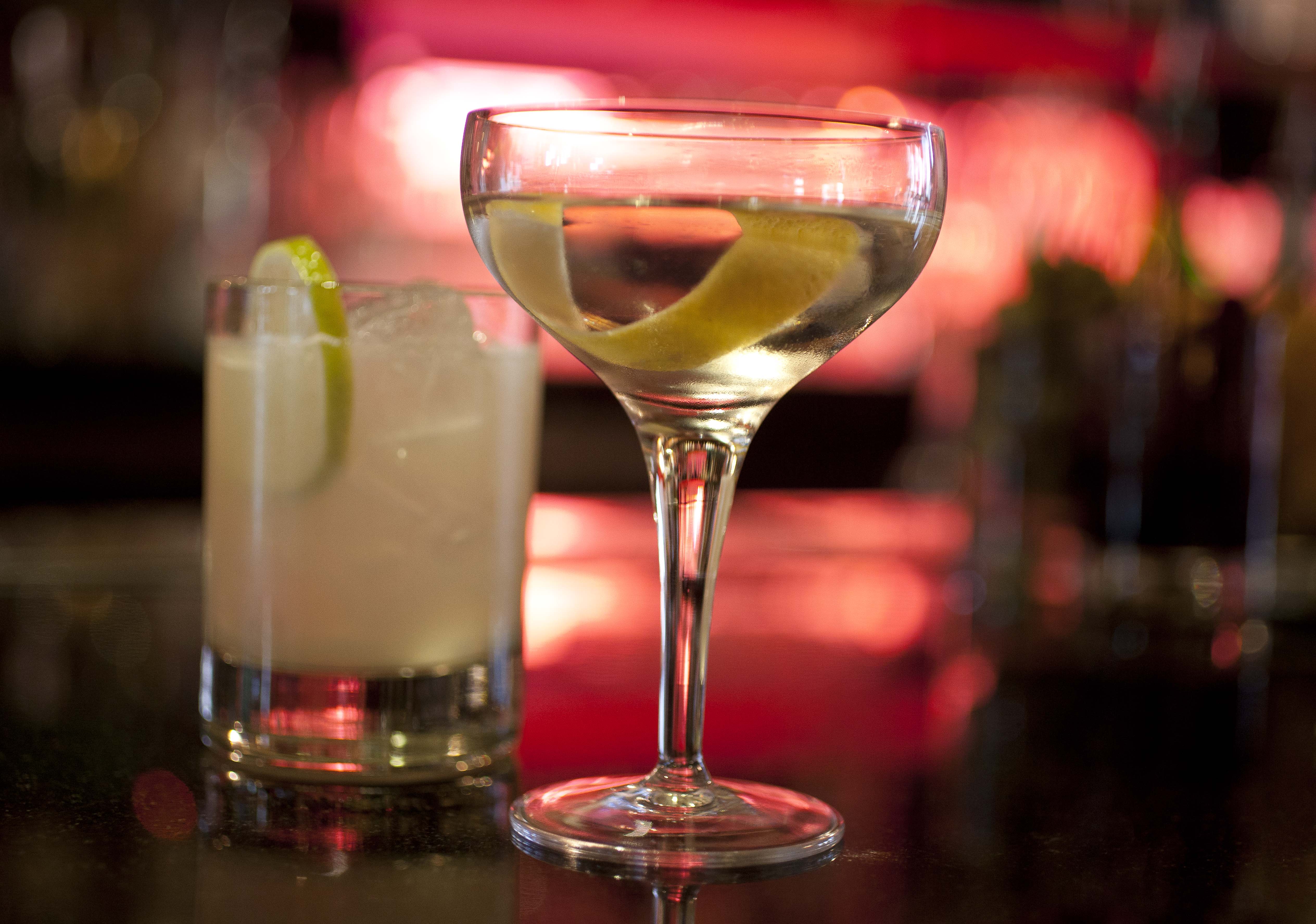 An agave Margarita and gin Martini made by mixologist Jacques Bezuidenhout sit on a bar in the Starlight Room of the Sir Francis Drake Hotel in San Francisco, Dec. 20, 2012.