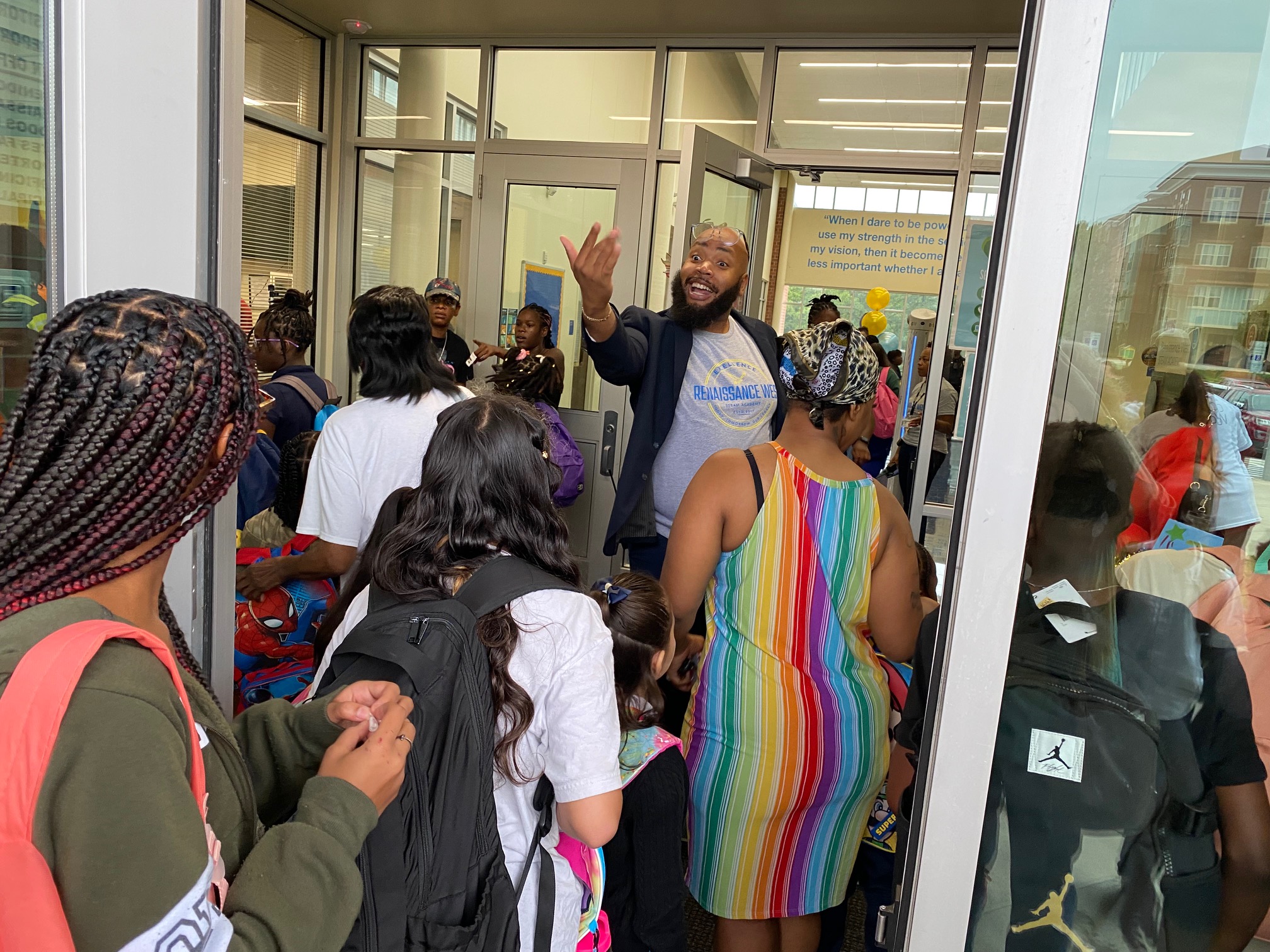 Principal Dwight Thompson welcomes families and students to Renaissance West STEAM Academy on the first day of school Monday.