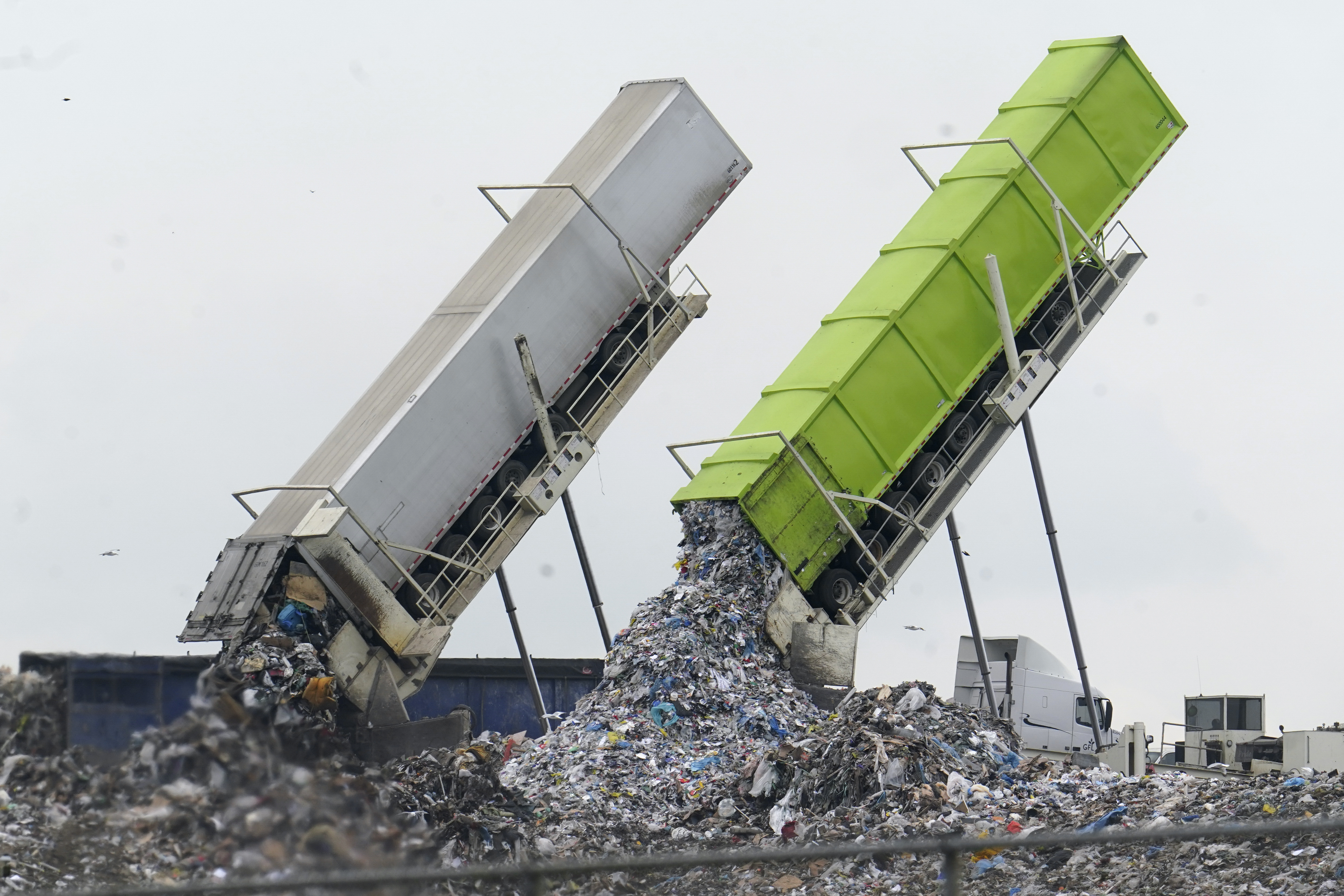 Garbage is unloaded into the Pine Tree Acres Landfill in Lenox Township, Mich., on July 28, 2022. State bans on commercial food waste have been largely ineffective, researchers found.