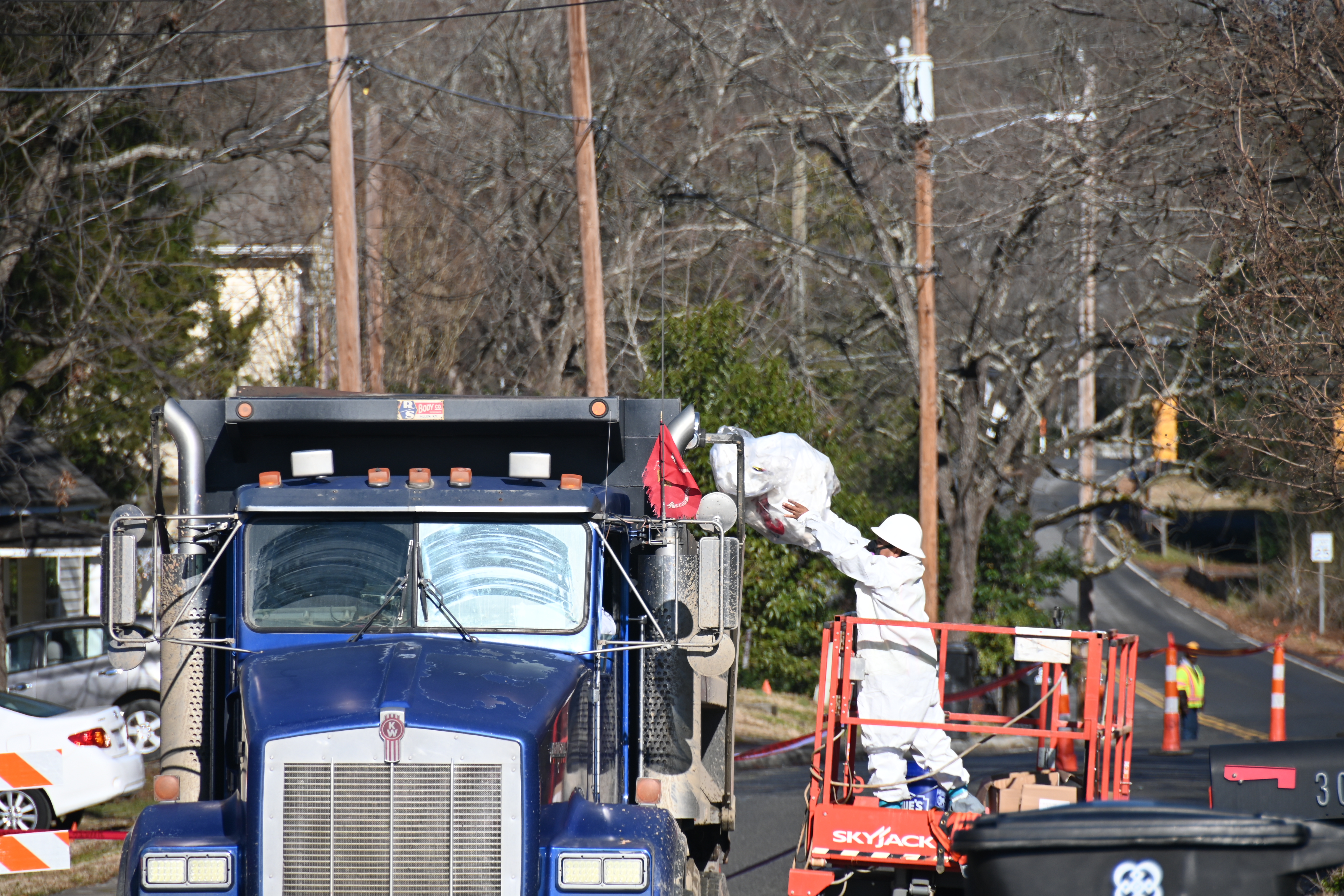 Contractors for Charlotte Water remove asbestos-laden soil from Sloan Street in Davidson during a water main upgrade project in January.
