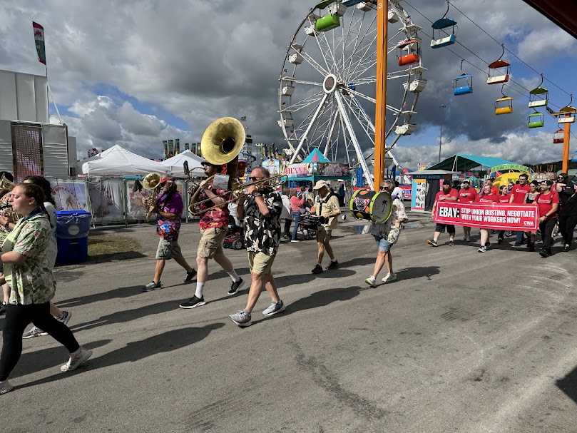 Hundreds of union workers take part in a parade and rally on the last day of the New York State Fair.