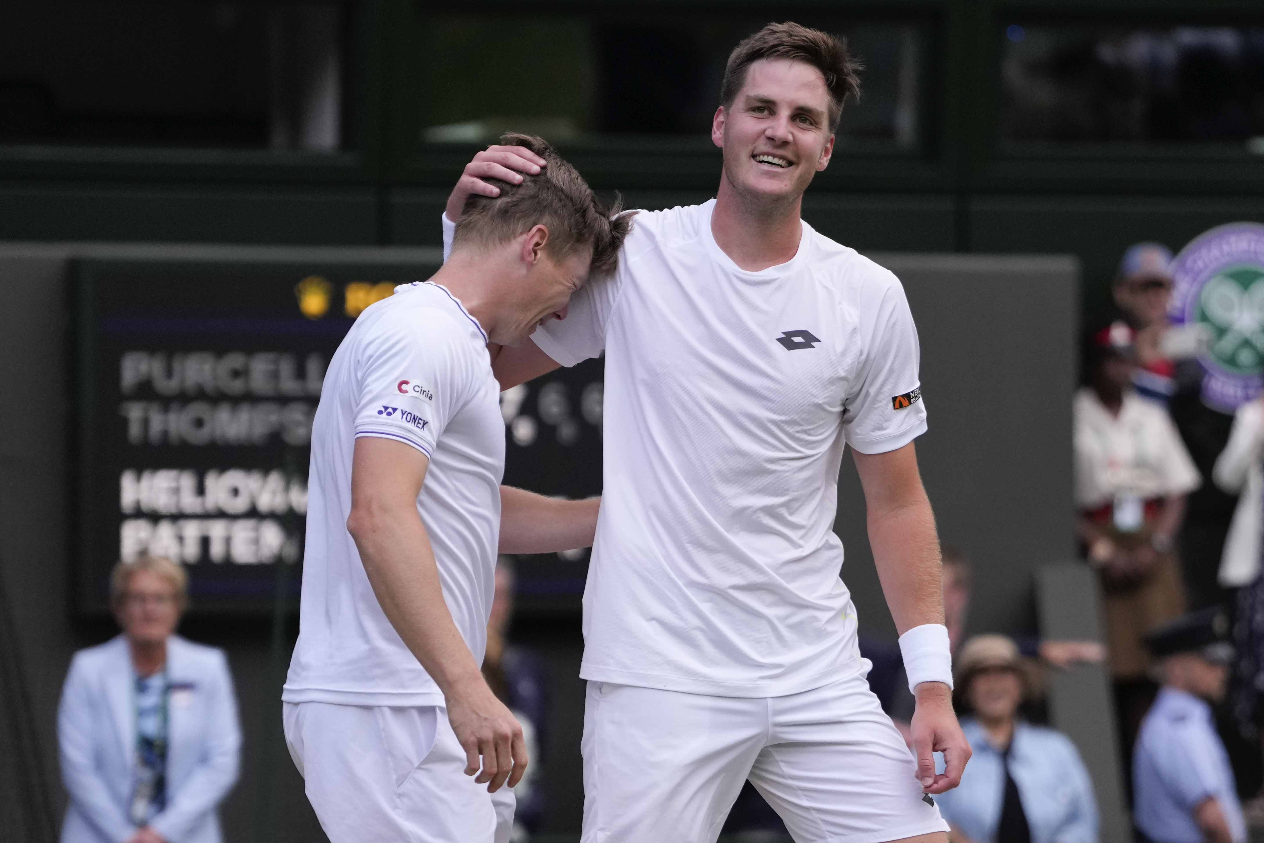 Harri Heliovaara, left, of Finland and Henry Patten of Britain celebrate after defeating Australia's Max Purcell and compatriot Jordan Thompson in the men's doubles final at the Wimbledon tennis championships in London, Saturday, July 13, 2024.(AP Photo/Alberto Pezzali)