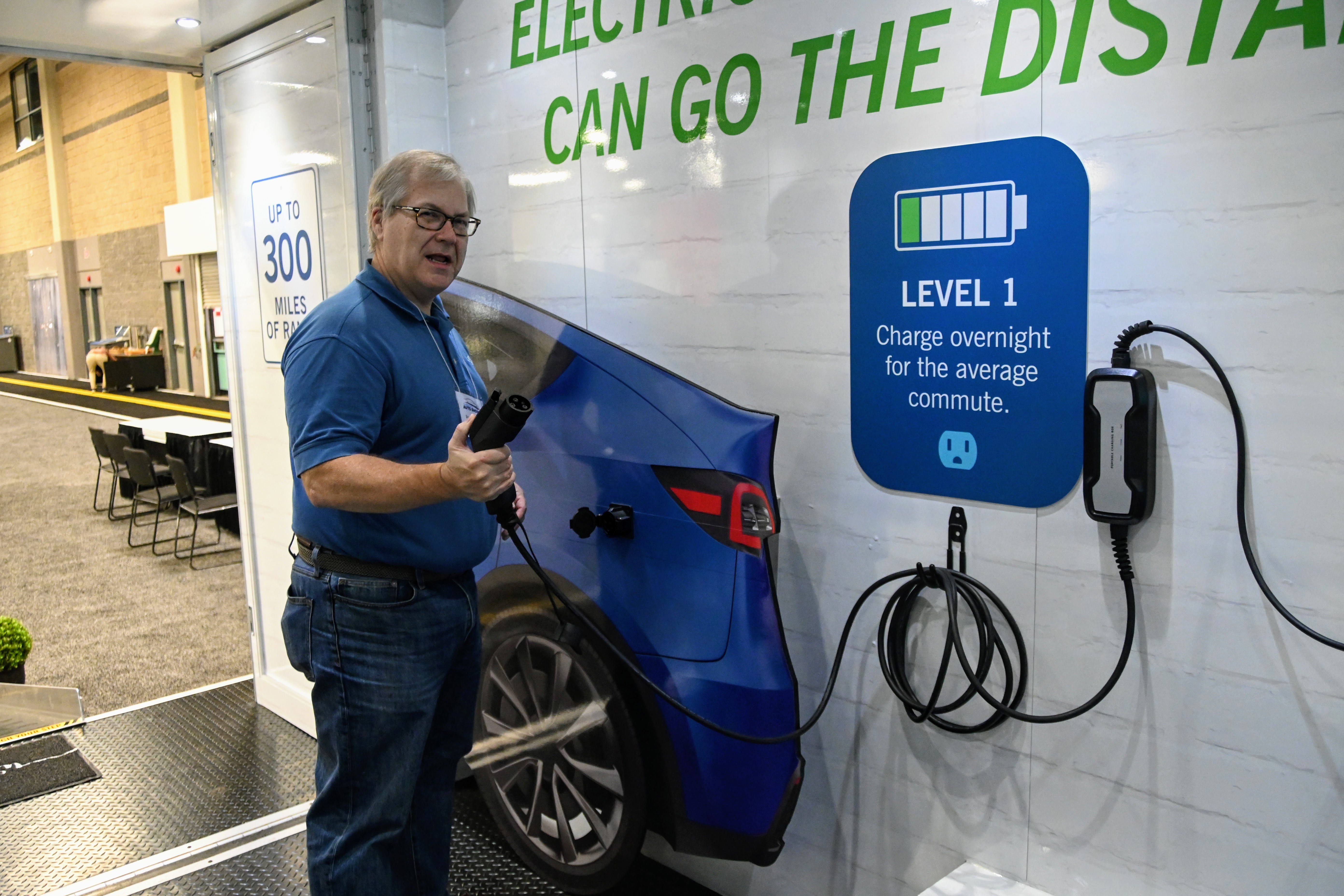 Randy Wheeless of Duke Energy talks about the different types of electric vehicle chargers at the 2021 Charlotte Auto Show.