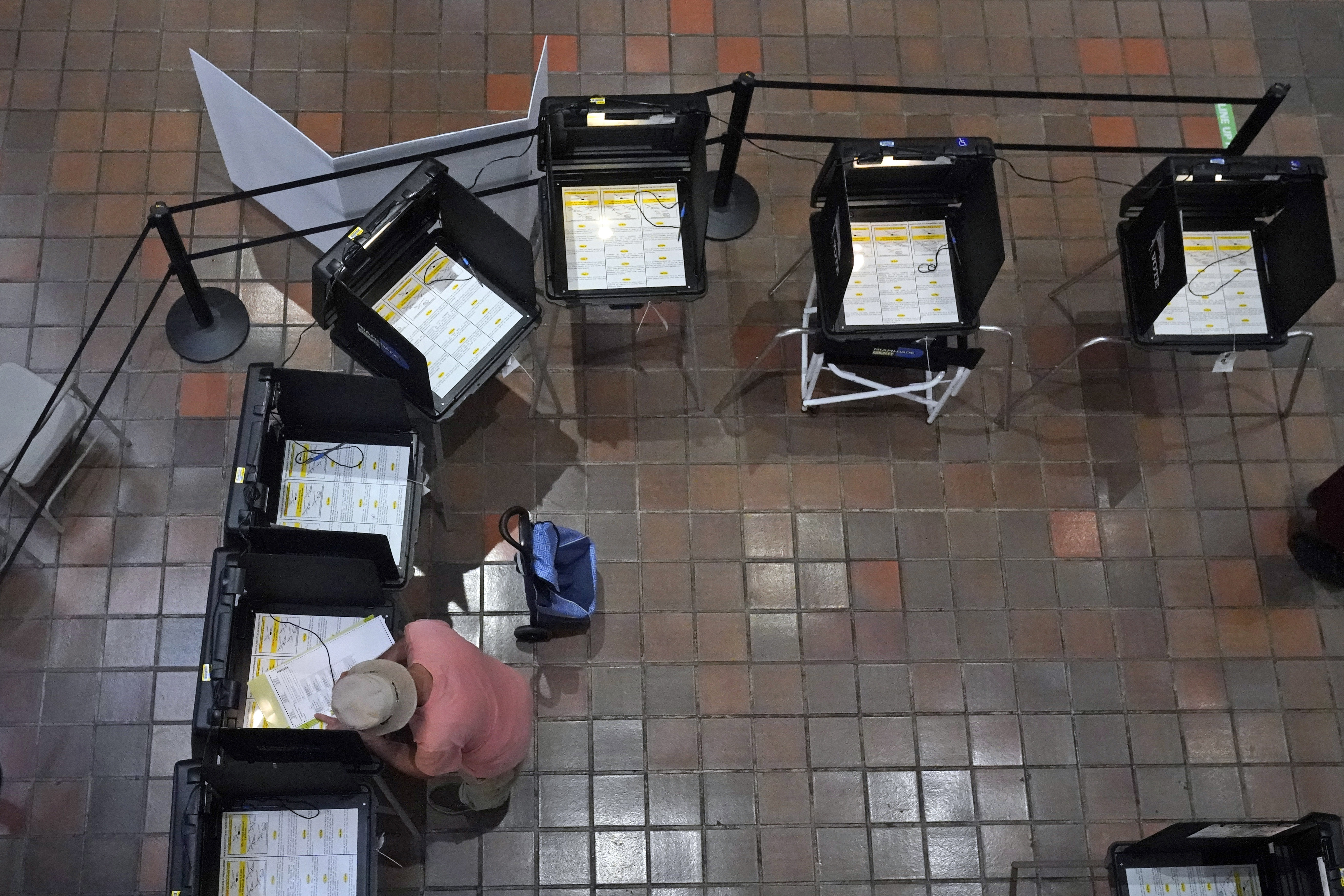 A voter fills out his ballot