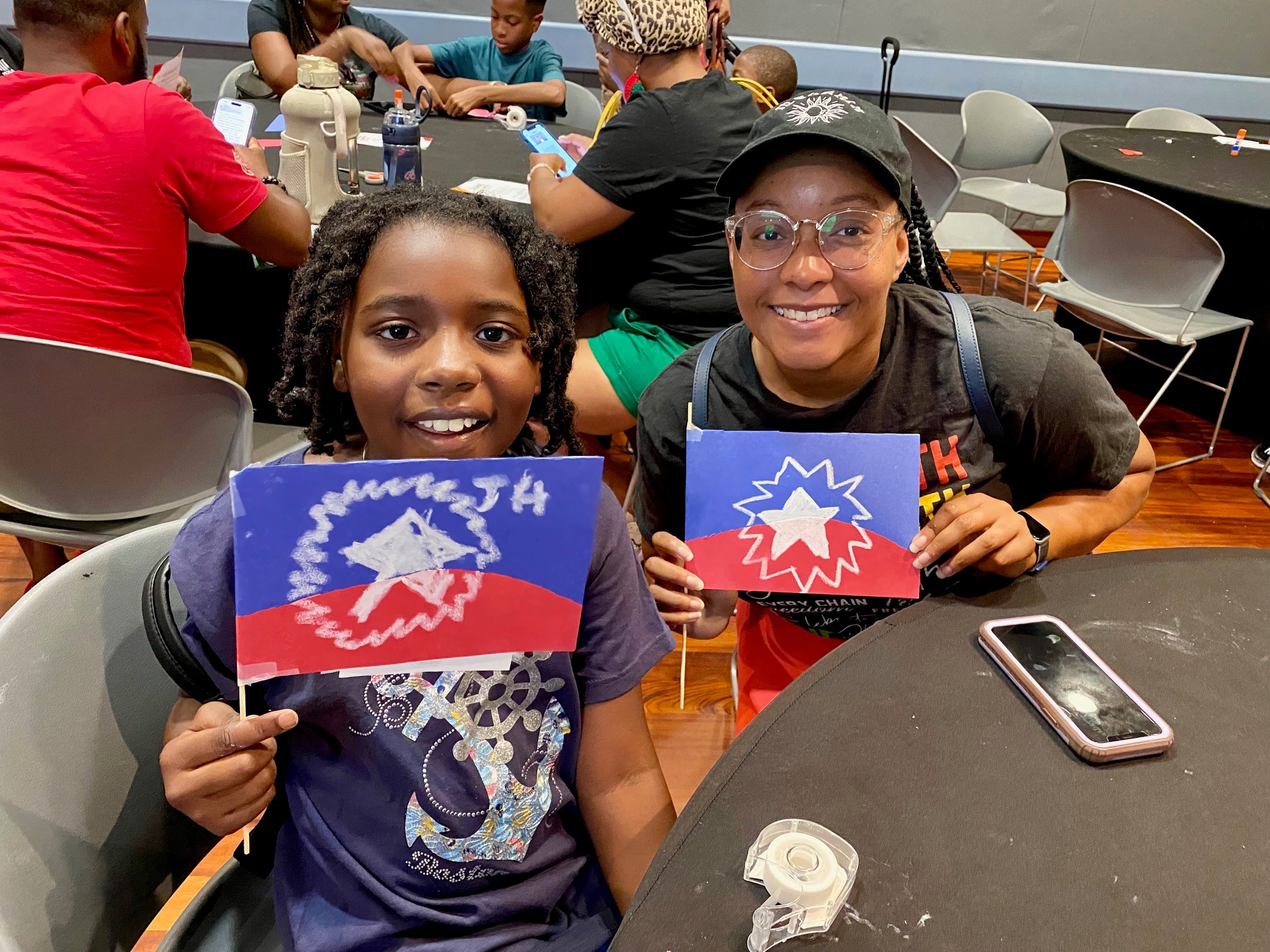 Adreonna Bennett (right) brought her daughter, Navaeh Perry, to make Juneteenth flags at the Harvey B. Gantt Center for African-American Arts + Culture.