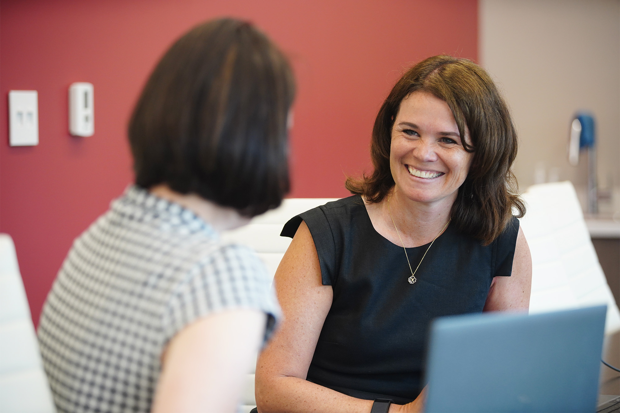 Impressia Bank President Mary Kate Loftus (right) chats with Martha Seidenwand, Impressia's vice president, on Monday, June 17, 2024, at the bank's regional headquarters in Seven Hills, Ohio. Impressia Bank, a division of CNB Bank created and managed by women, launched in May 2023. 