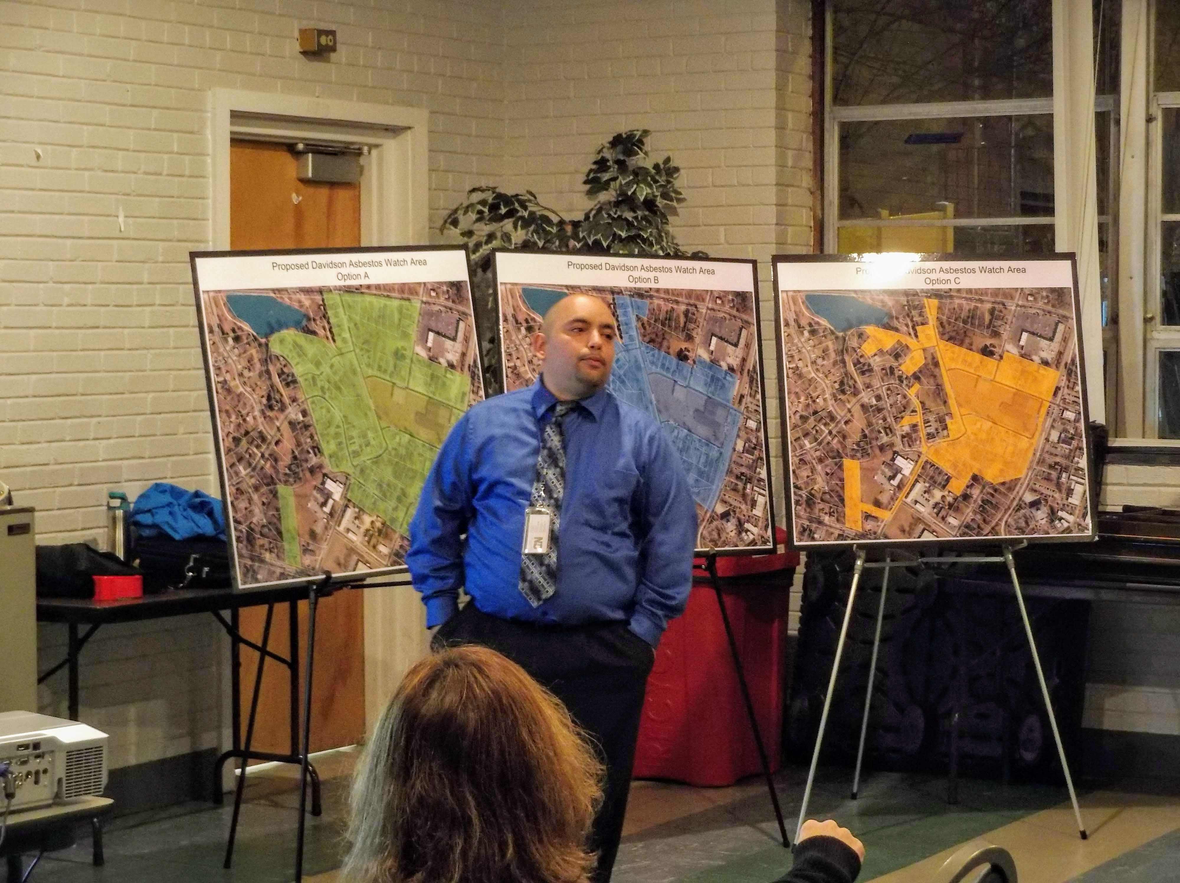 Miguel Alvalle of the N.C. Department of Environmental Quality explains the Davidson "asbestos watch area" to residents Monday at the Ada Jenkins Center in Davidson. 