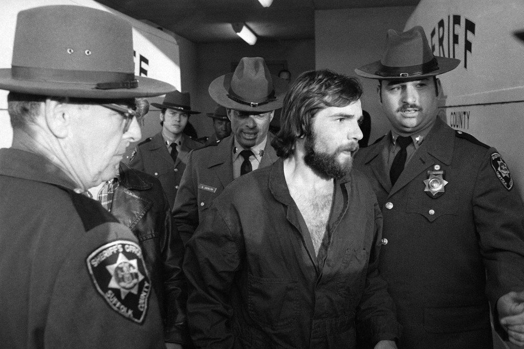 Ronald DeFeo Jr., center, leaves Suffolk County district court after a hearing, Nov. 15, 1974. 