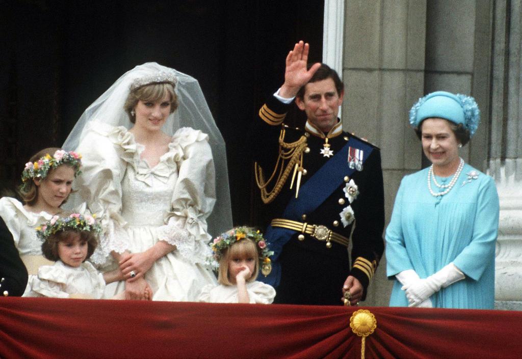 Queen Elizabeth (far right) with her son Prince Charles (right) and his new bride, Princess Diana of Wales ( center). 