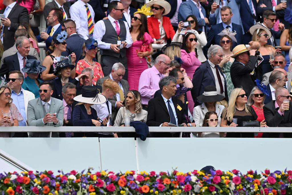 Racegoers are spotted during the Epsom Derby Festival horse racing event at Epsom Downs Racecourse in Epsom, England, on June 3, 2022.