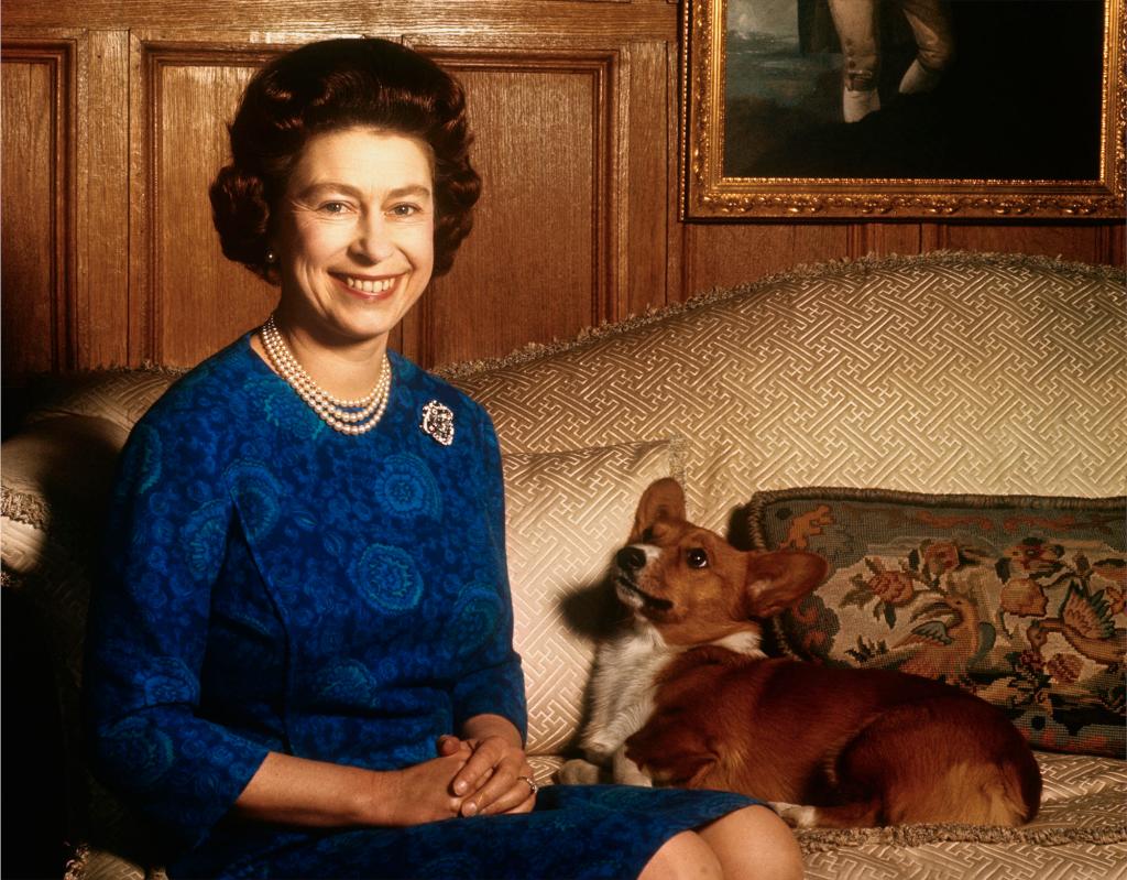 Queen Elizabeth II smiles radiantly during a picture-taking session in the salon at Sandringham House