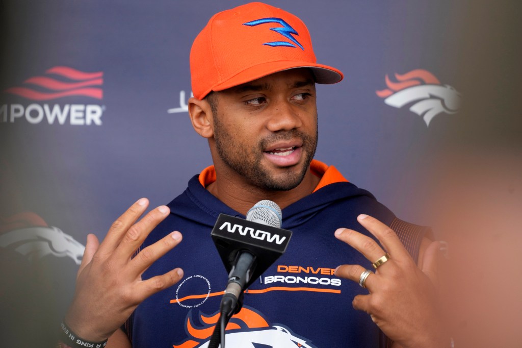 Russell Wilson talks to Broncos reporters on Sept. 21, 2022.