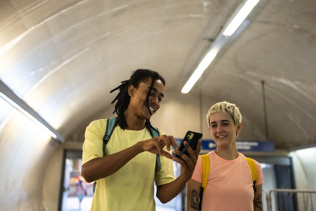 Two people looking at phone