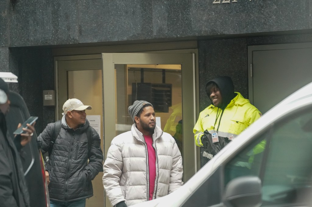 Migrants outside 220 West 42nd Street shelter in Manhattan. 