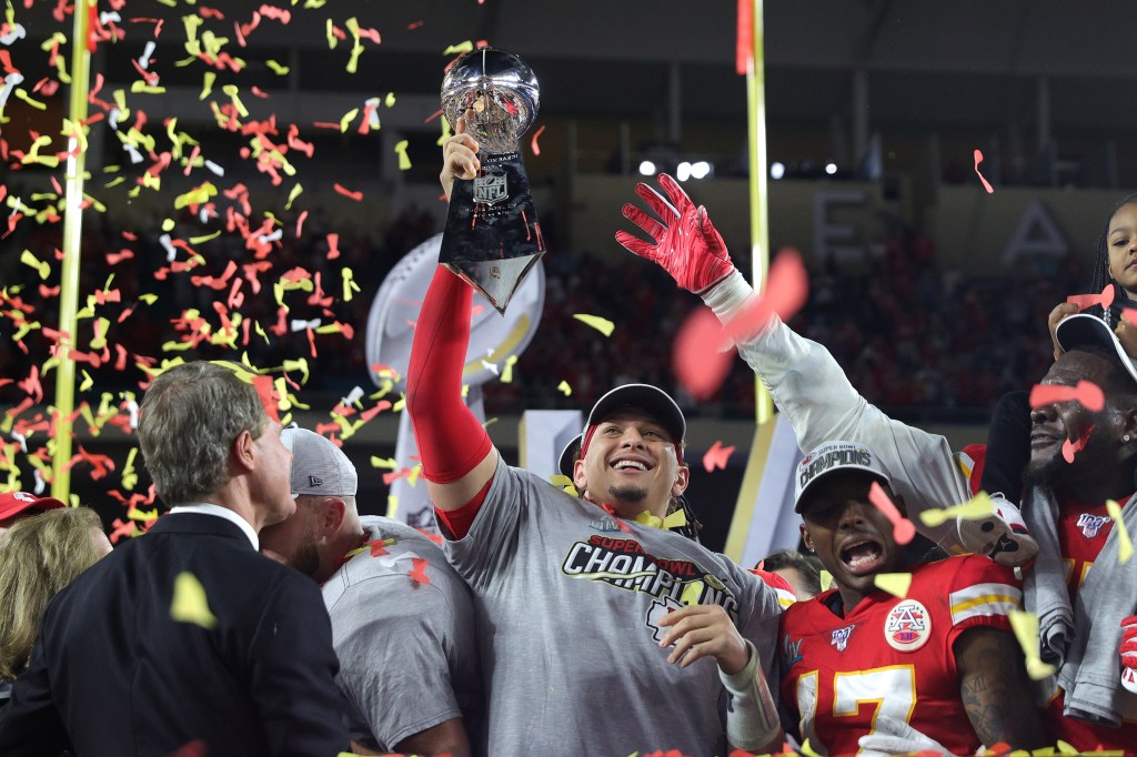 Patrick Mahomes hoists the Lombardi Trophy after winning Super Bowl 2020.