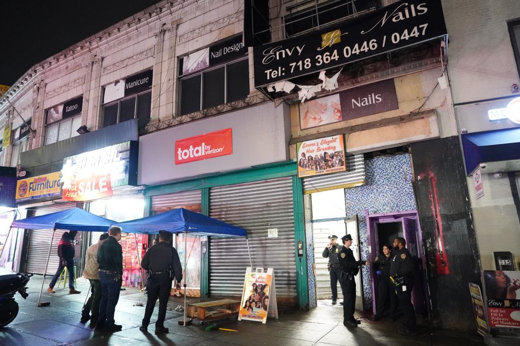 Police and officials outside raided storefront turned migrant shelter.