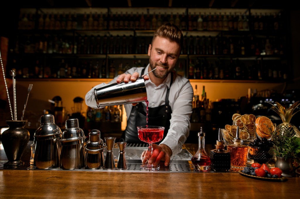 Man pouring alcohol 