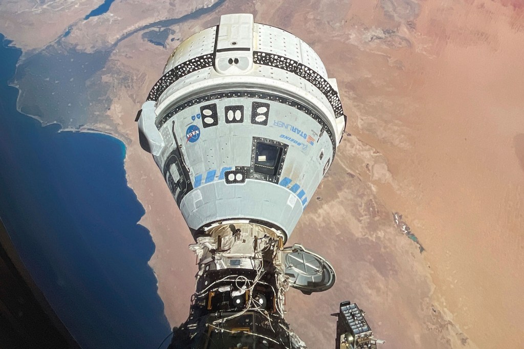 This photo provided by NASA shows the Starliner spacecraft docked to the Harmony module of the International Space Station, orbiting 262 miles above Egypt's Mediterranean coast,