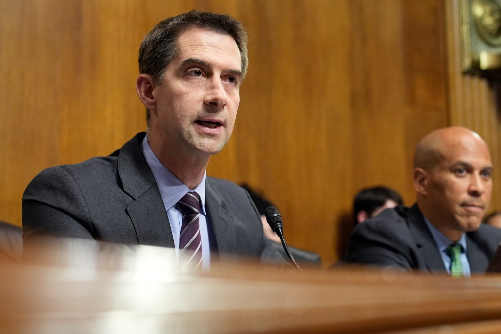 Sen. Tom Cotton seated next to Chair Sen. Cory Booker during a Senate Judiciary Subcommittee on Criminal Justice and Counterterrorism hearing on prison labor