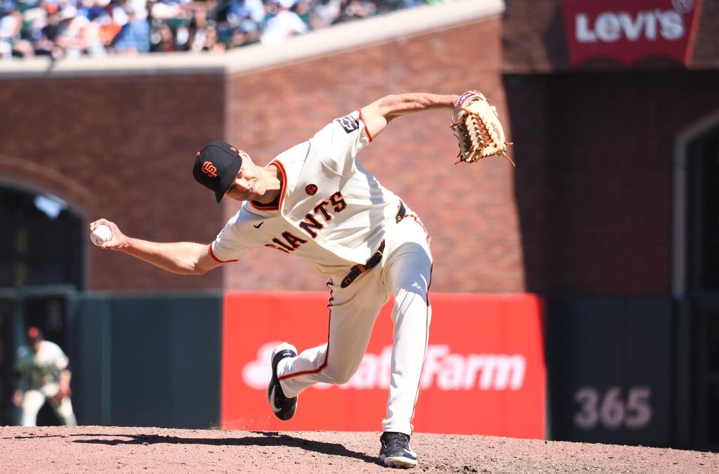 San Francisco Giants relief pitcher Tyler Rogers (71) pitches the ball against the Los Angeles Dodgers during the ninth inning at Oracle Park.